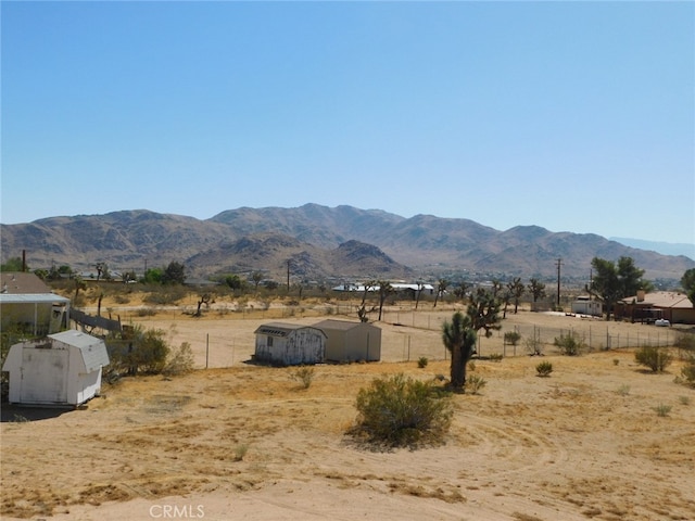 view of mountain feature with a rural view