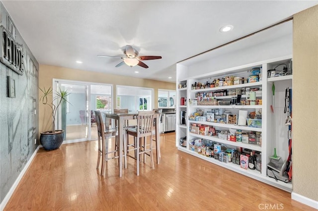 dining area featuring ceiling fan and light hardwood / wood-style flooring