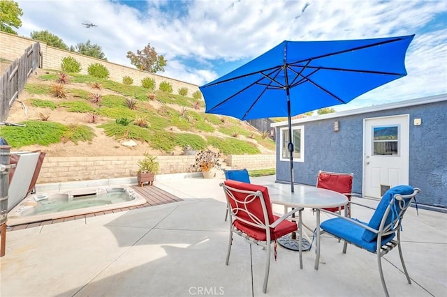 view of patio / terrace featuring a jacuzzi