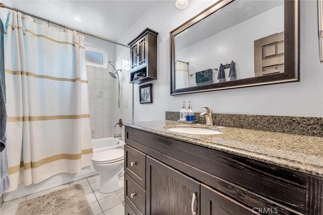 full bathroom with tile patterned flooring, shower / tub combo, vanity, and toilet