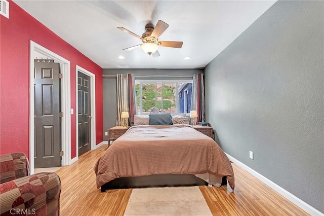 bedroom featuring ceiling fan and light hardwood / wood-style floors