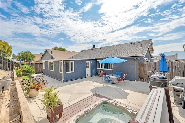 back of house featuring a patio