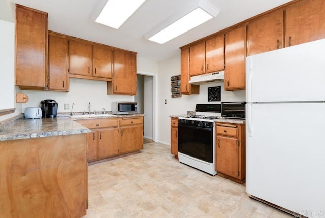 kitchen with sink and white appliances