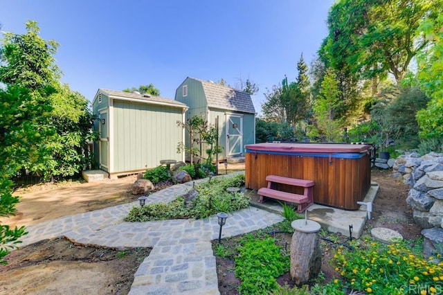 view of yard with a storage unit, a patio area, and a hot tub