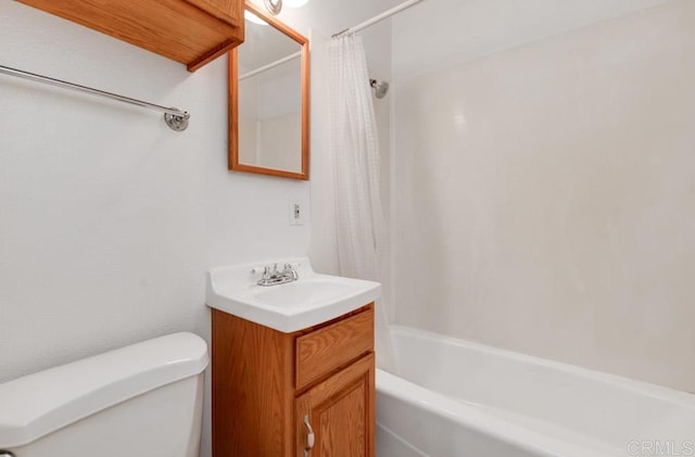 full bathroom with vanity, toilet, and shower / bath combo with shower curtain