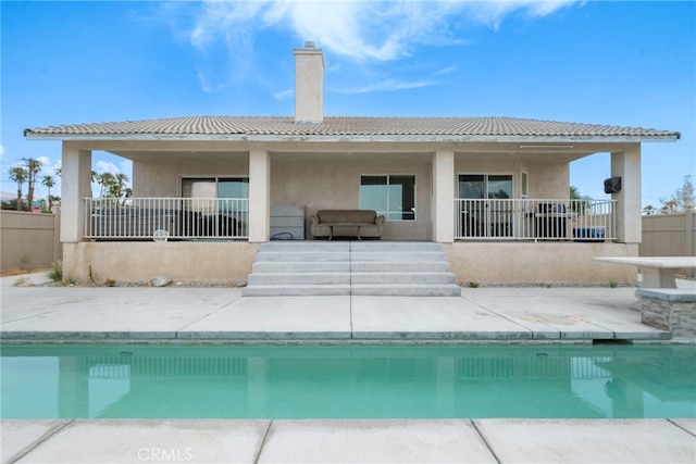 back of property with a patio area