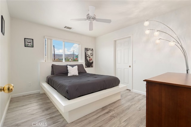 bedroom featuring light wood-type flooring and ceiling fan