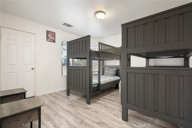 bedroom with light hardwood / wood-style floors