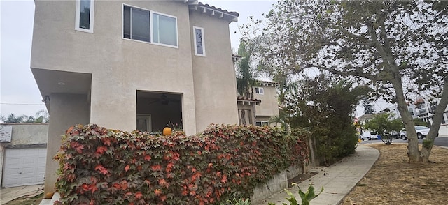 view of property exterior featuring a garage