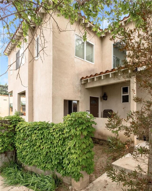 back of house with stucco siding