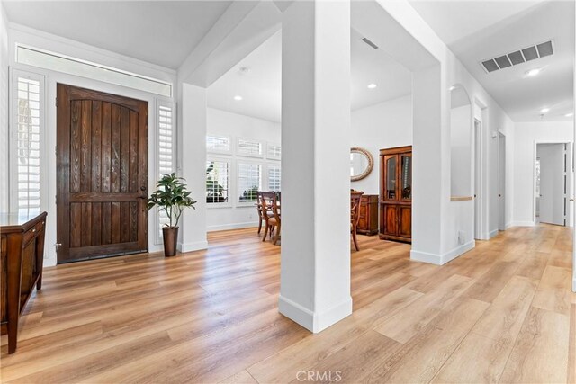 entrance foyer with light hardwood / wood-style flooring