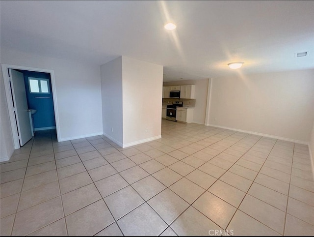 empty room with light tile patterned flooring