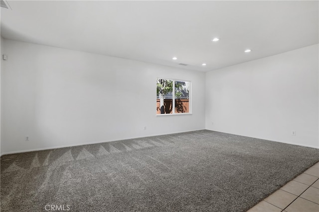 empty room featuring light colored carpet