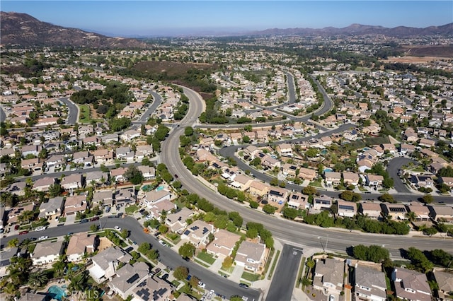 birds eye view of property with a mountain view