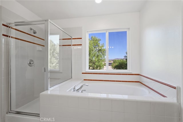 bathroom with shower with separate bathtub