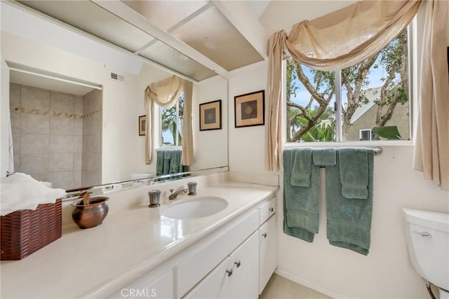 bathroom with vanity and toilet