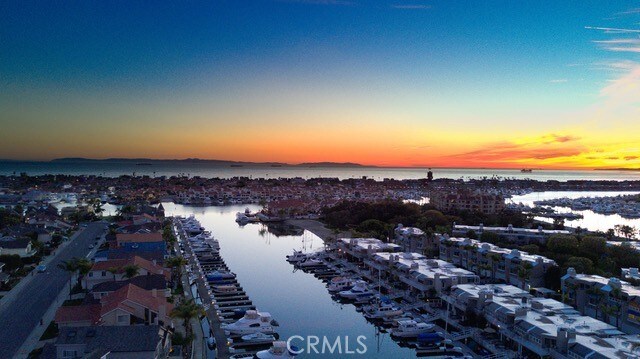 aerial view at dusk with a water view