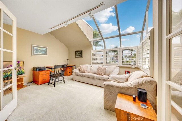 living room with rail lighting and carpet floors