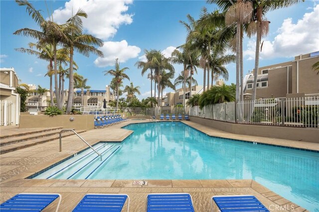 view of swimming pool with a patio