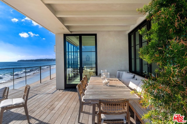 balcony featuring a water view