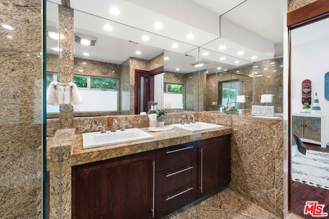 bathroom featuring hardwood / wood-style flooring and vanity