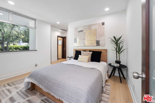 bedroom featuring light hardwood / wood-style floors