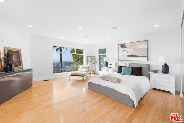 bedroom with light hardwood / wood-style floors