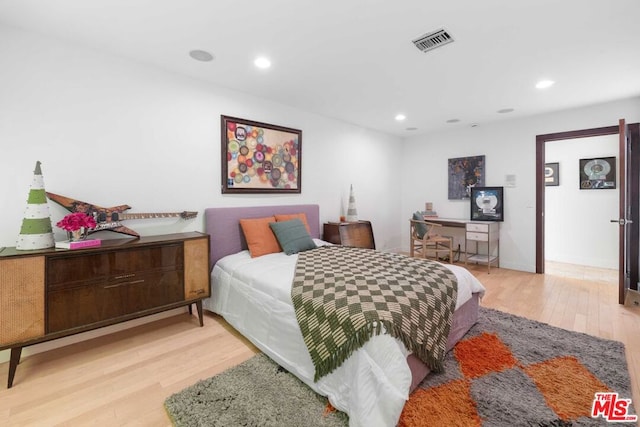 bedroom featuring light hardwood / wood-style floors