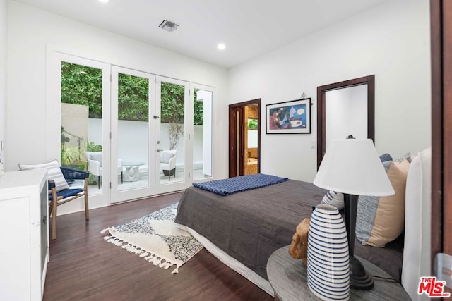 bedroom with access to exterior, french doors, and dark hardwood / wood-style floors