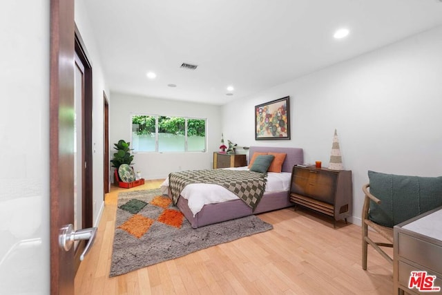 bedroom featuring light hardwood / wood-style floors