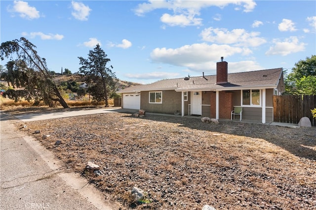 ranch-style home featuring a garage