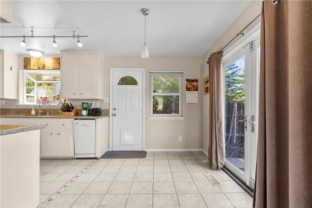 kitchen with white dishwasher, a wealth of natural light, decorative light fixtures, and white cabinetry