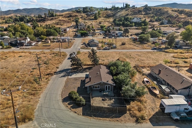 birds eye view of property featuring a mountain view