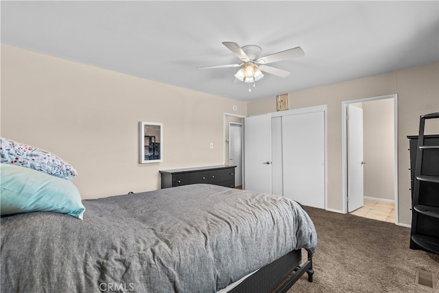 carpeted bedroom with ceiling fan