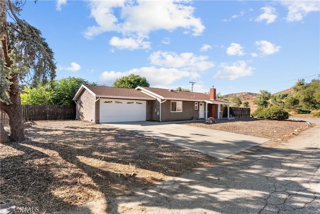 single story home featuring a garage