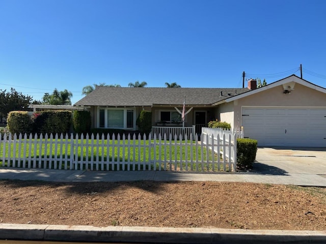 ranch-style home featuring a garage and a front yard