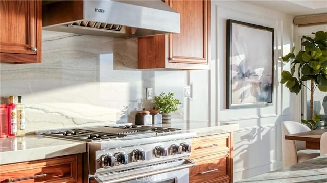 kitchen with ventilation hood and stainless steel stove