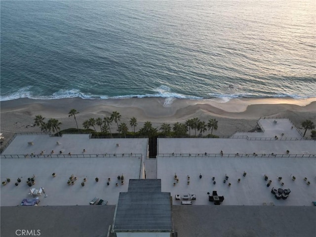 aerial view with a water view and a beach view