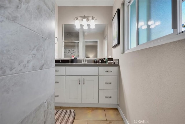 bathroom featuring tile patterned floors, plenty of natural light, and vanity