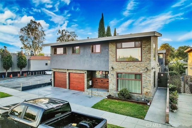 view of front of home featuring a garage and cooling unit