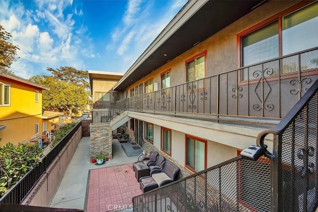 view of home's exterior featuring a patio area and an outdoor hangout area