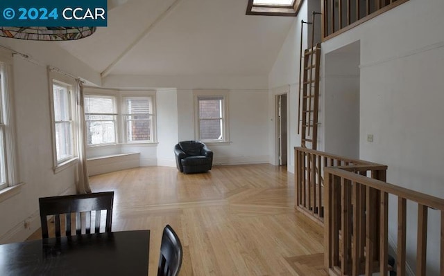 interior space featuring french doors, high vaulted ceiling, and light parquet floors