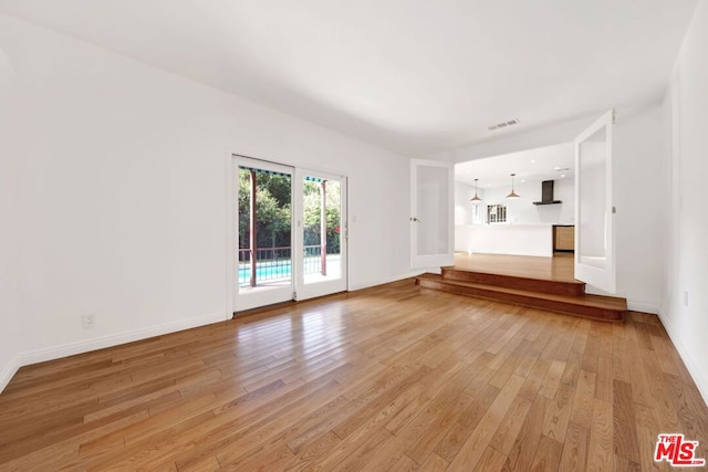 unfurnished living room with light wood-type flooring