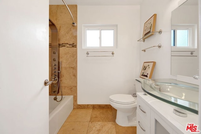 full bathroom with vanity, toilet, a wealth of natural light, and tile patterned flooring