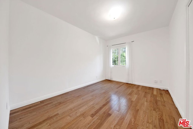 empty room with light hardwood / wood-style floors