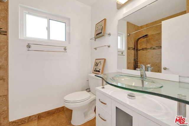 bathroom featuring vanity, toilet, and tile patterned floors