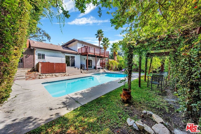 view of swimming pool with a patio