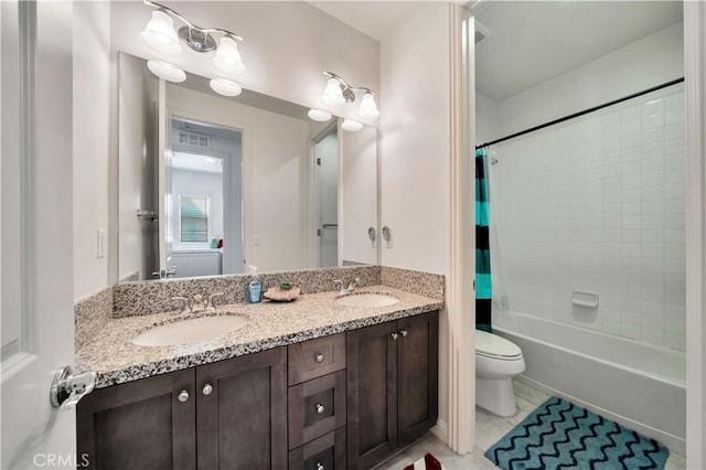 full bathroom featuring tile patterned flooring, vanity, shower / tub combo with curtain, and toilet