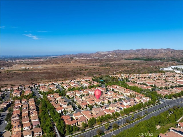 birds eye view of property featuring a mountain view