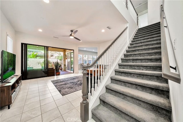 tiled entrance foyer featuring ceiling fan